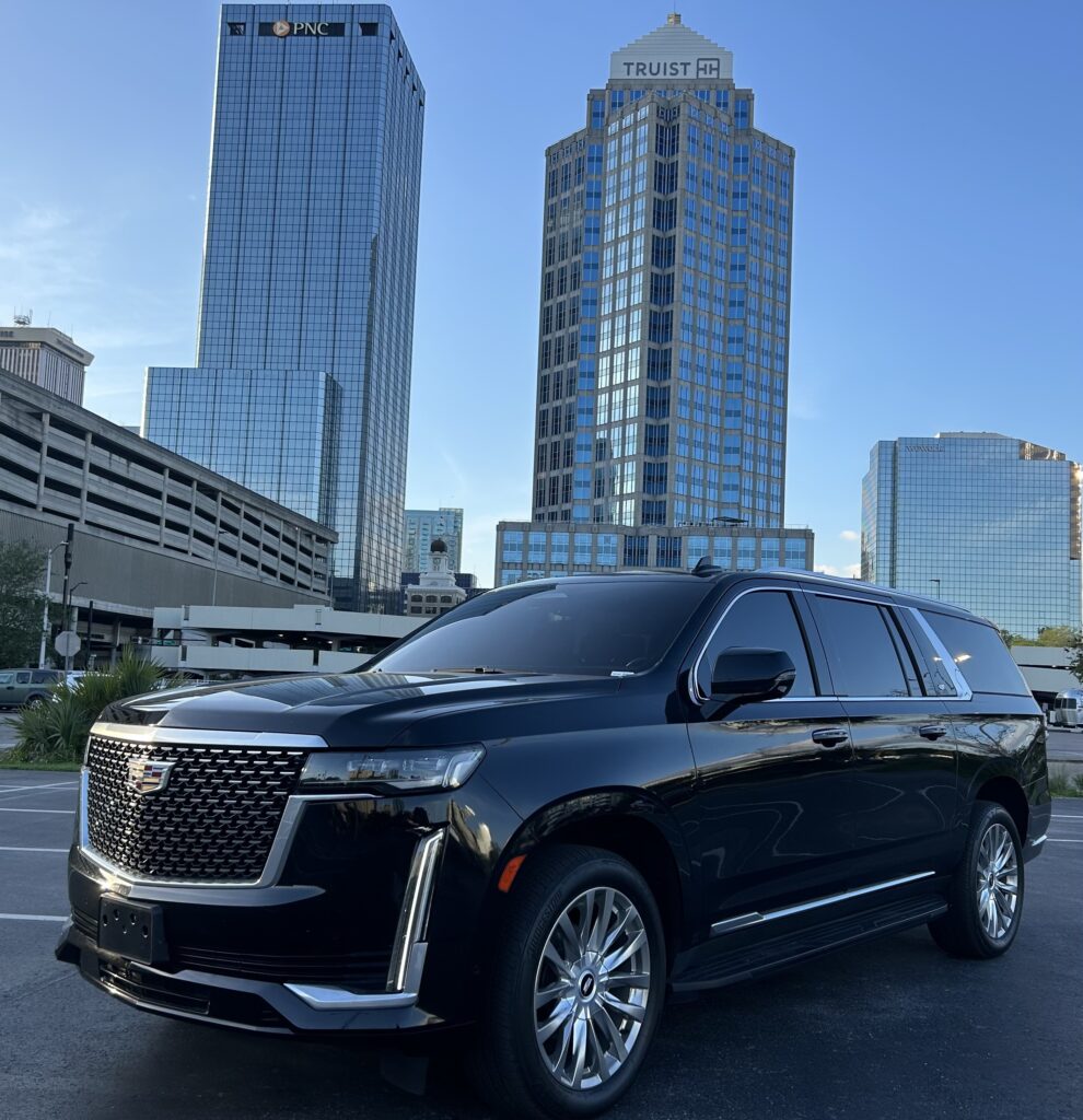 A luxurious Cadillac Escalade showcased in downtown Tampa, featuring sleek design details and enhanced with premium limo service
