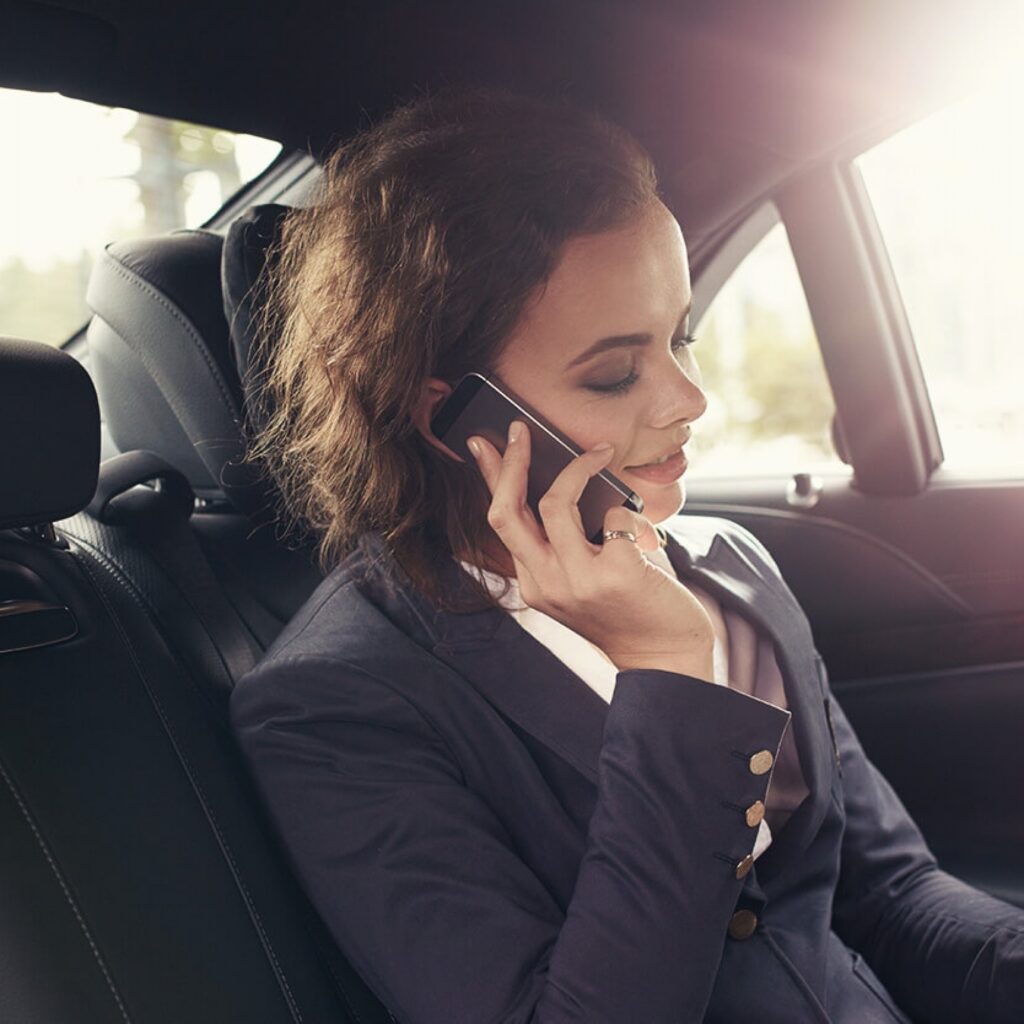 lady talking to cell phone getting transportation by skyline limousine