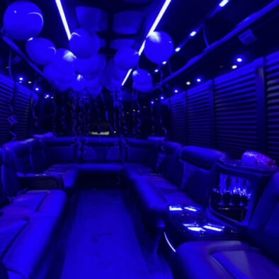 Interior of a 20-passenger party bus decorated with balloons for a birthday celebration